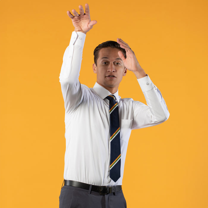 Navy blue tie with white, green, and yellow stipe on white shirt