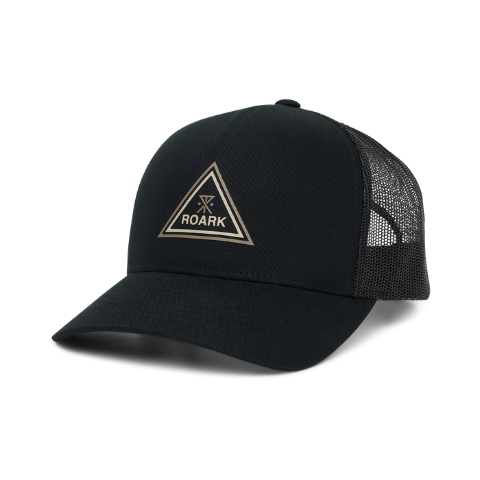 Black Roark Station Trucker Tricamp Snapback Hat with tan triangle logo and mesh panels, displayed on flat lay against white background
