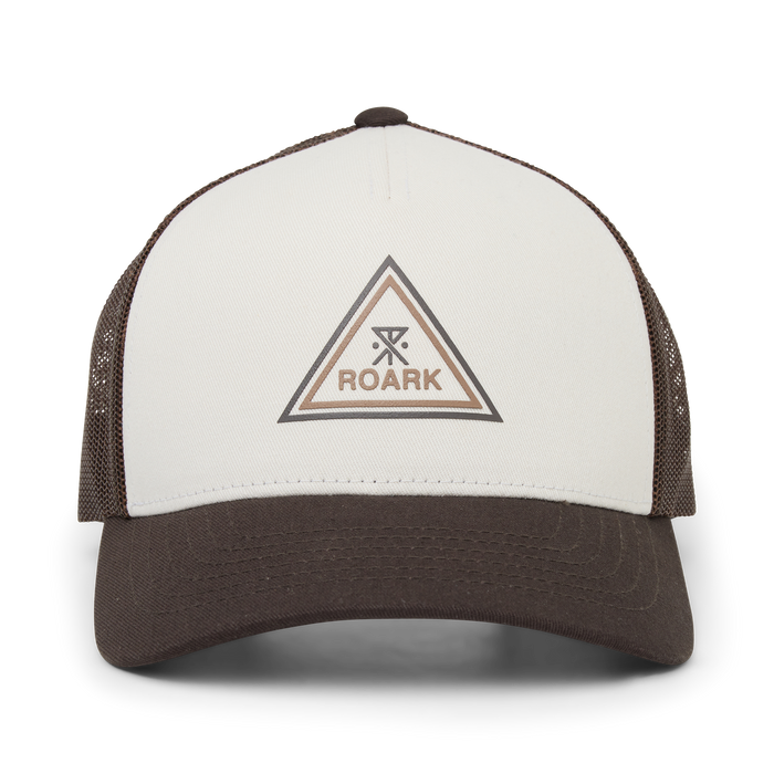 Brown and cream Roark Station Trucker hat with mesh panels, triangle logo embroidered on front panel in flat lay view