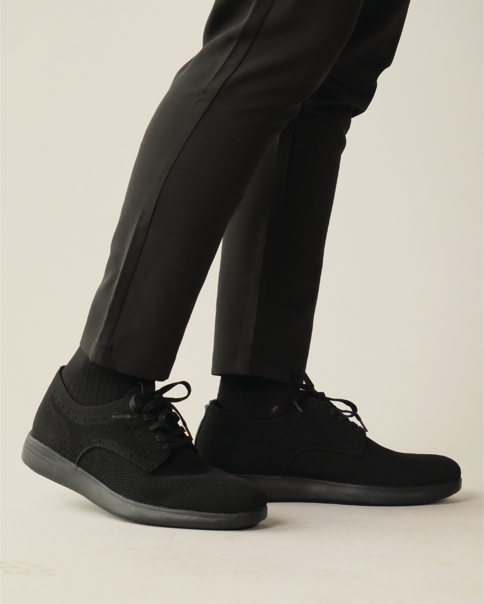 Black shoes worn with black pants