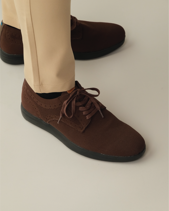 Brown shoes with black outsole worn with khaki pants