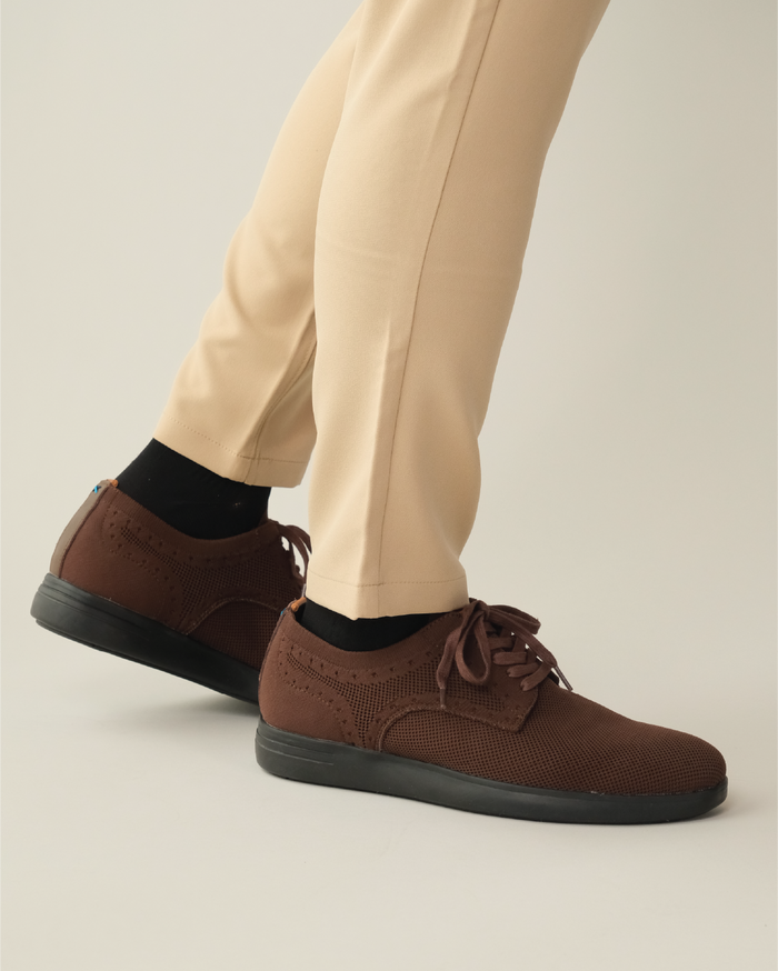 Brown shoes with black outsole worn with khaki pants
