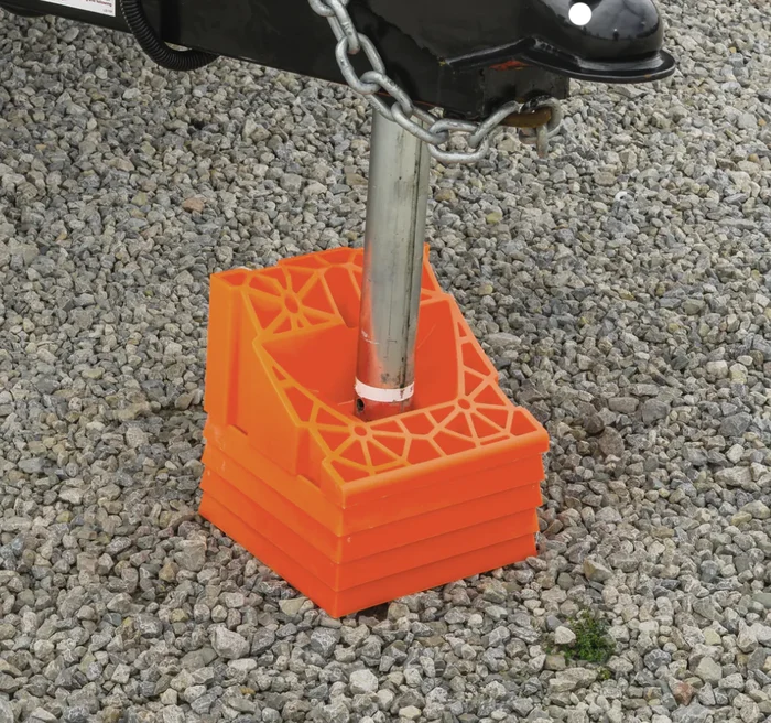 Orange RV Leveling Chock in Use with Stabilizer Jack - Installation View | United RV Parts