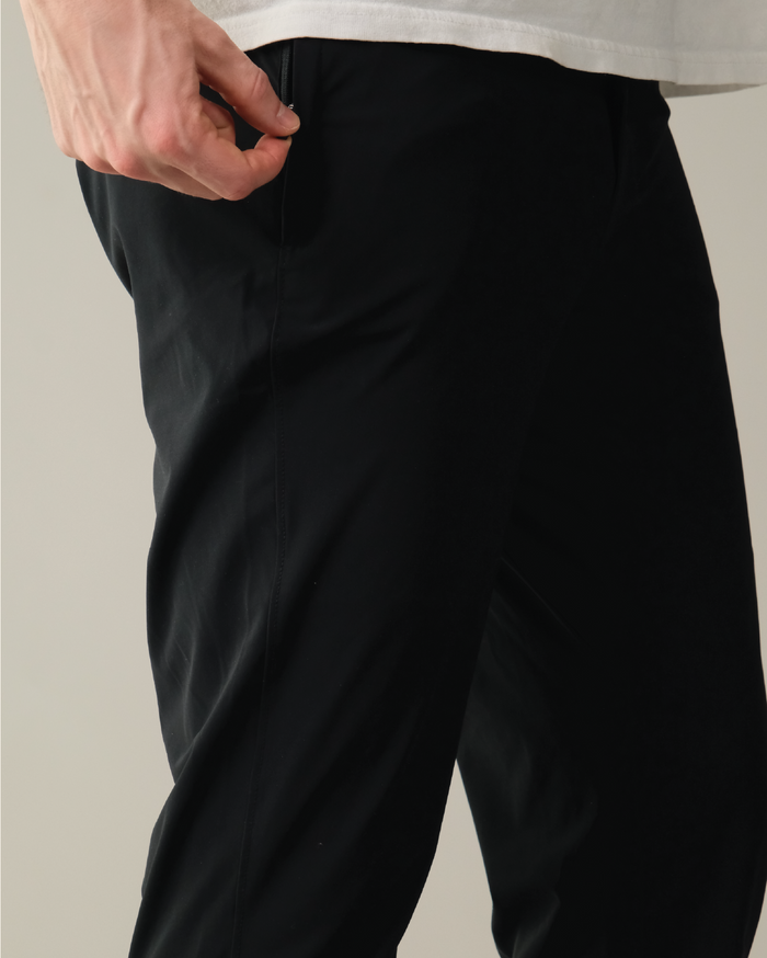 Pitch black pants with hidden zipper.