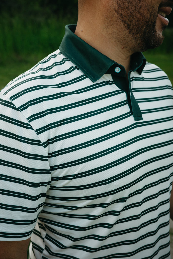 Person wearing a cream and green striped short sleeve polo shirt