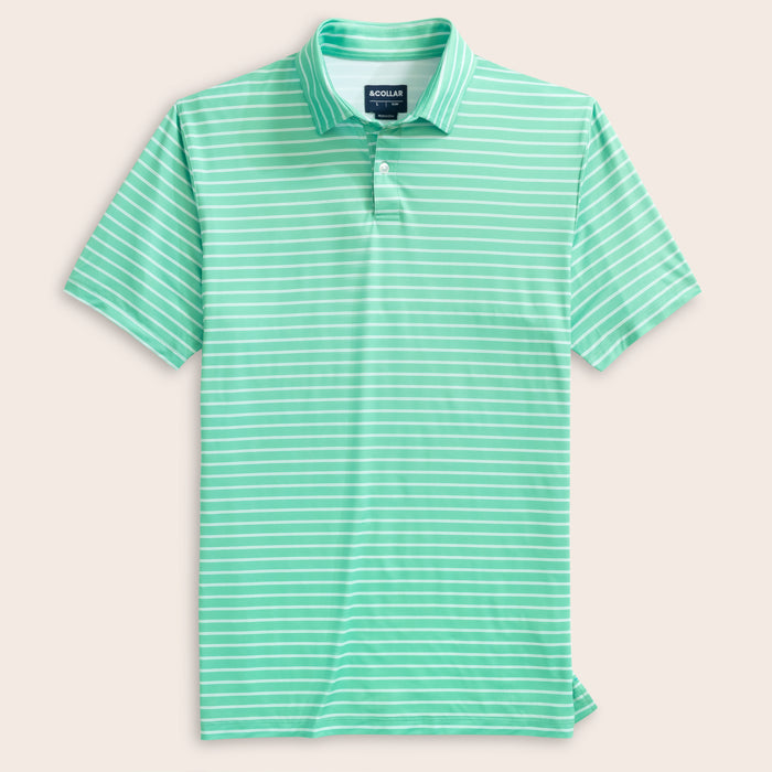Green and white striped polo shirt on a light pink background