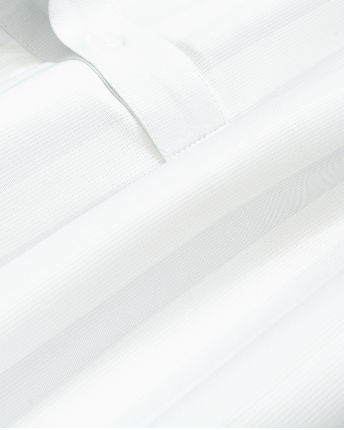 Fabric detail shot of white and gray striped short-sleeve polo shirt, showing texture