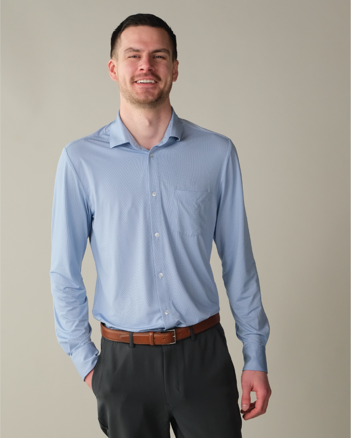 Man wearing a french blue shirt and dark pants