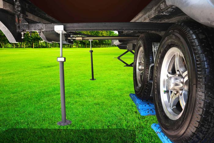 Ultra-Fab Steel RV Slide Out Supports Installed Under RV Chassis on Grass - In Use | United RV Parts