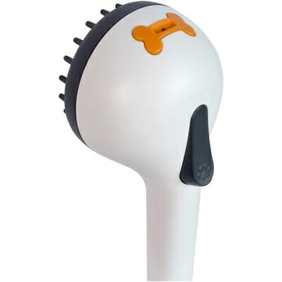 White Valterra Deluxe Pet Shower Head with Gray Bristle Brush Face and Orange Bone Detail - Side Angle | United RV Parts