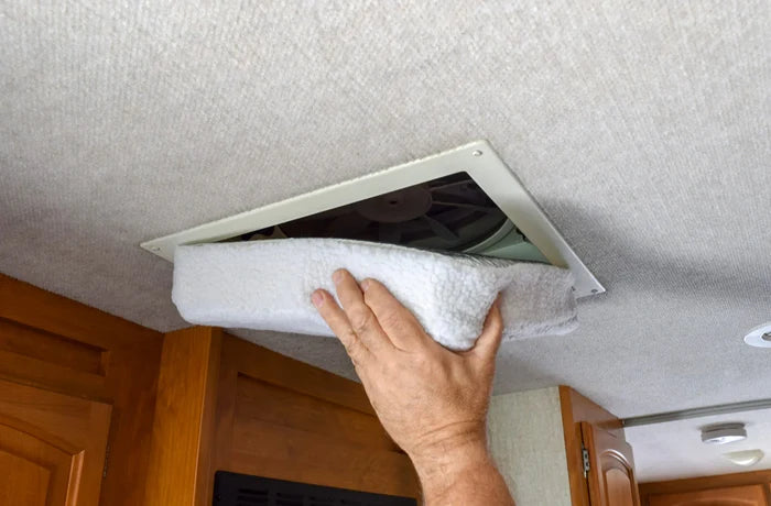 Hand Installing White Valterra RV Roof Vent Insulator into 14x14 Ceiling Vent - In-Use | United RV Parts