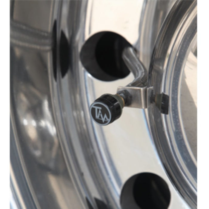 TireMinder Brass Transmitter Installed on Chrome RV Wheel - Side View | United RV Parts