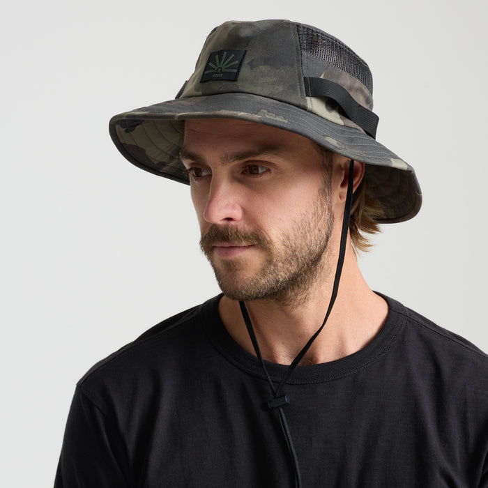 Camouflage adventure hat with fedora style and strap, ideal for outdoor travel and exploration.