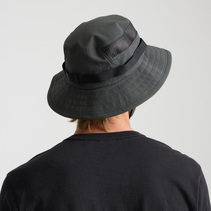Stylish black fedora hat on a natural outdoor backdrop, perfect for adventure and travel