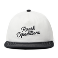 Stylish white Roark trucker hat, ideal for outdoor adventures and travel, displayed on a neutral background.