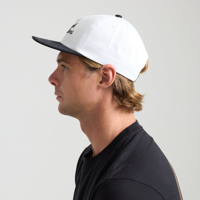 Stylish white Roark baseball cap perfect for outdoor adventures and travel.