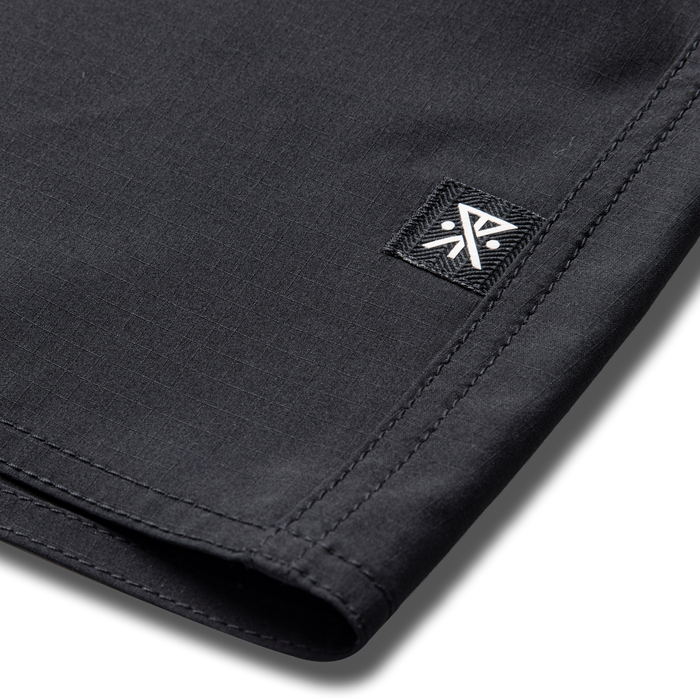 Stylish black and grey denim Venture jacket by Roark, designed for adventure and travel.