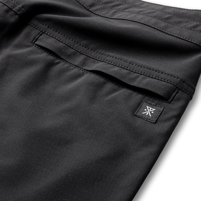 Roark active Bermuda-style pants designed for adventure and outdoor activities, showcased in sleek black.