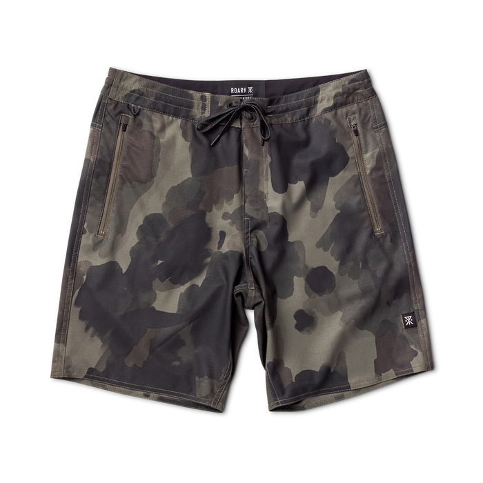 Exploring the unknown with Roark - camouflaged adventure gear in natural surroundings.