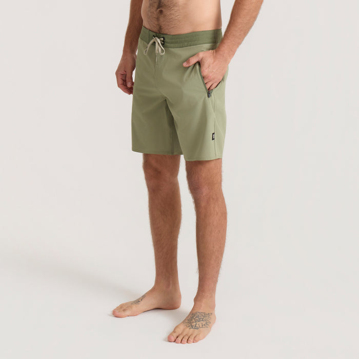 Men's Venture Hybrid Trunk in dusty sage green with drawstring waistband, shown on model from waist down