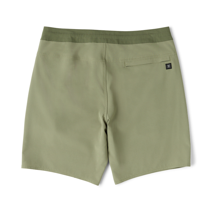 Dusty sage green Venture Hybrid Trunk displayed flat lay, showing back pocket and branded label detail