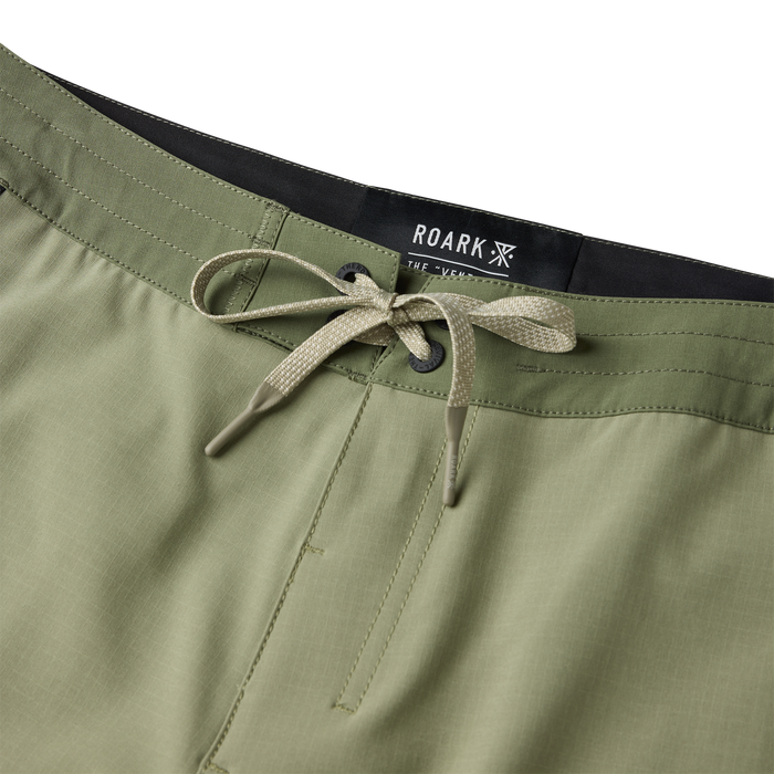 Dusty sage Venture Hybrid Trunk by Roark with tan drawstring and black waistband, detail shot of waistband and tie closure