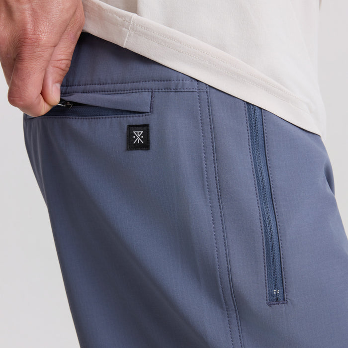 Active pants designed for adventure, ideal for hiking and outdoor activities, featured in a natural setting.