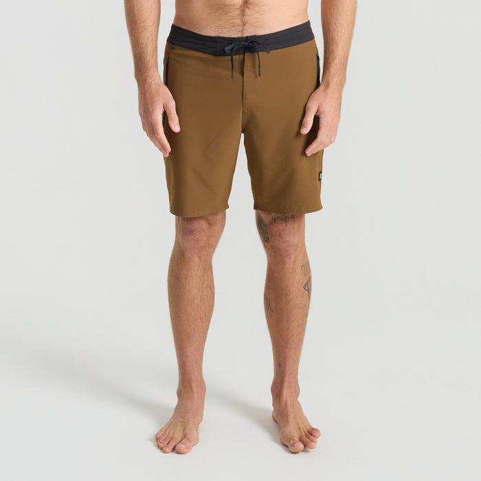 Barechested adventurer enjoying a tropical destination, embodying Roark's spirit of outdoor exploration.