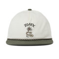 Adventurous traveler in Roark gear navigating a rugged landscape at sunrise