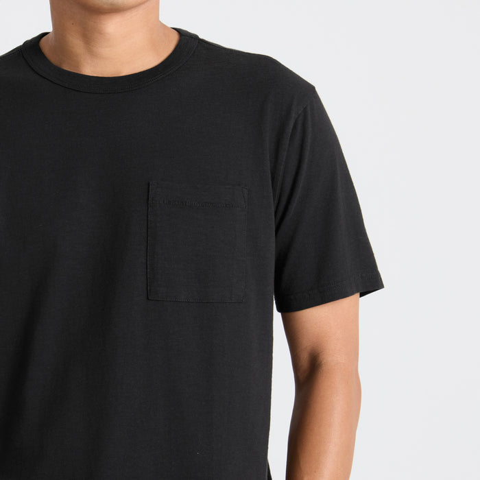 Versatile black active shirt designed for adventure and travel by Roark, perfect for outdoor explorations.