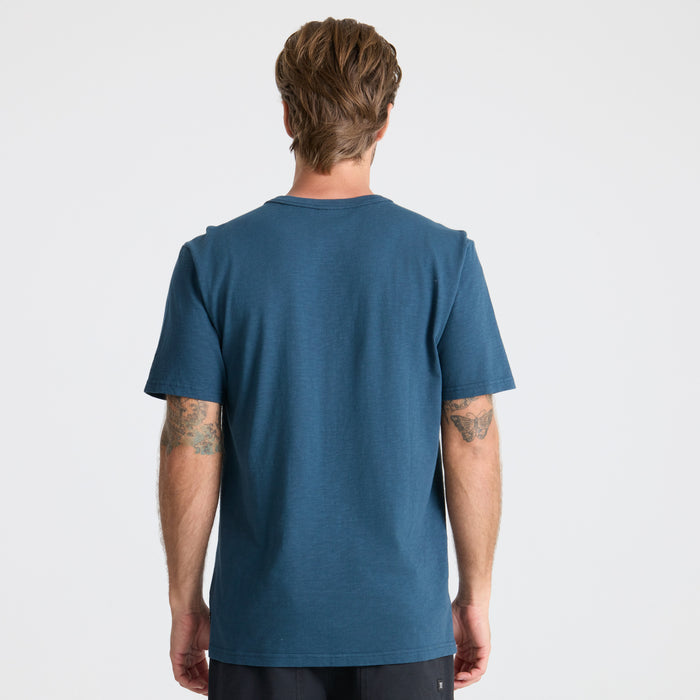Close-up of a navy Roark active shirt highlighting the elbow and sleeve details, designed for adventure and travel.