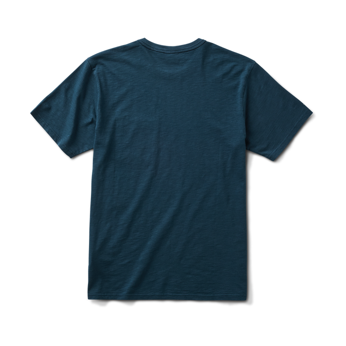Man in a navy active Roark T-shirt paired with denim, ready for outdoor adventure.