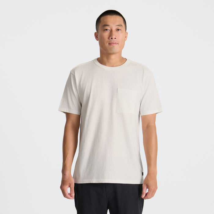 Close-up of a Roark active shirt featuring intricate pocket details and visible buttons, designed for adventure and travel.
