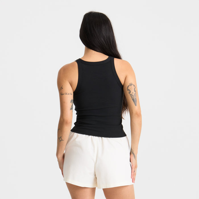 Close-up of a sleeveless active tank top highlighting the shoulder and neck design, perfect for outdoor adventures and travel.