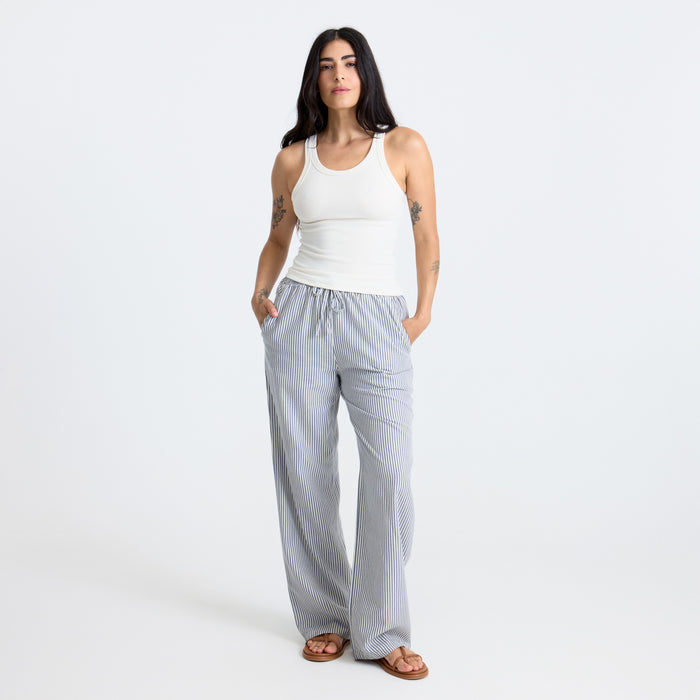 Close-up of grey active pants and foot, ideal for travel and adventure, showcasing the comfortable and durable design.