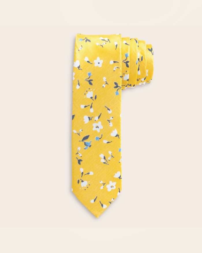 Yellow tie with white and blue floral design